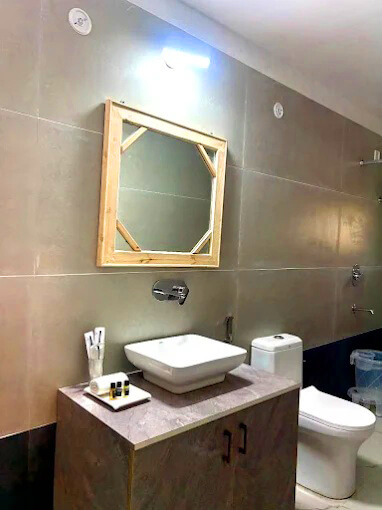 Deluxe Hill View Room at Hotel Naini Inn Nainital with mountain views